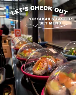 YO! Selfridges tasting menu: teriyaki salmon, asparagus nigiri, miso, and cotton candy cheesecake, presented on a table.