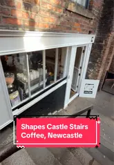 Shapes Castle Stairs coffee shop exterior on unique stone steps between Newcastle Castle and the Quayside.