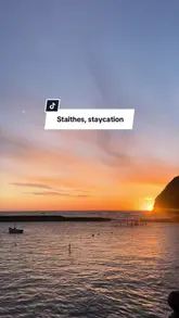 A travel-style montage showcasing a weekend trip to the coastal village of Staithes. The video features scenic shots of the beach and sunset, interior shots of a cottage, a visit to a sweet shop, and glimpses of local dining at the Cod & Lobster.