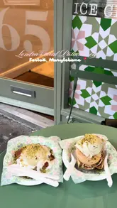 A short, visually-focused reel showcasing various Lebanese desserts and drinks at Festok in Marylebone, London. The video features close-up shots of ice cream being scooped onto kunafa, baklava, and a hot chocolate, highlighting the textures and presentation of the items.