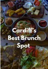 A vibrant brunch spread at Casablanca Cardiff with shakshuka, flatbreads, dips, and Moroccan bread on a wooden table.