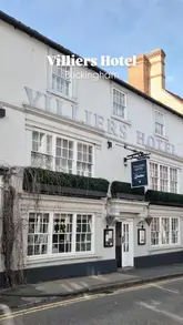 Historic Villiers Hotel exterior in Buckingham, a welcoming sight for guests enjoying a pleasant and comfortable stay.