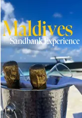 A montage of scenic beach shots at a luxury resort, featuring a sandbank, a boat, and a bento box meal served on the beach.