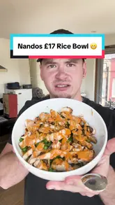Nando's Chicken, Halloumi & Rice Bowl, featuring grilled peri-peri chicken, halloumi cheese, and seasoned rice served in a bowl.