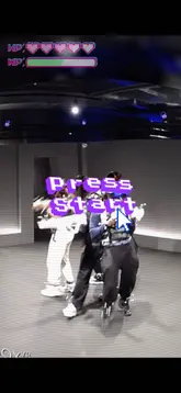 A group of friends participates in a VR gaming experience at Sandbox VR, wearing headsets and haptic vests while playing a zombie-themed game. The video captures their reactions and the immersive nature of the gameplay.