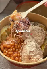 Golden brown loaded jacket potato, a popular viral food dish from SpudBros Express in Wakefield.