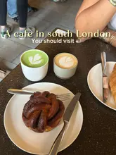 Cozy London cafe interior with customers enjoying artisanal coffee, vibrant matcha lattes, and fresh pastries; ideal for studying.