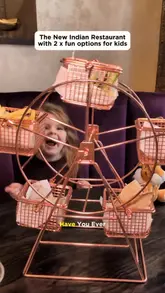 Kids at TYGA Manchester enjoying a fun Ferris wheel Naanza with butter chicken and building their own naan pizzas.