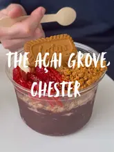 A short montage showcasing a visit to The Açai Grove in Chester, featuring close-ups of acai bowls, matcha, and iced coffee, along with shots of the interior and staff preparation.