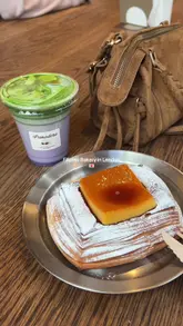 Here are a few options, keeping the character limit and SEO in mind:

**Option 1 (Concise & Keyword-rich):**
"Ube matcha latte and leche flan danish from Panadera, a Filipino bakery in London." (98 characters)

**Option 2 (Slightly more descriptive):**
"Panadera's ube matcha latte & leche flan danish, a popular Filipino bakery treat in London." (106 characters)

**Option 3 (Focus on visual with context):**
"Purple ube matcha latte and flaky leche flan danish from Panadera, a Filipino bakery in London." (111 characters)

I recommend **Option 1** for its directness and strong keywords.