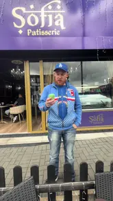 A creator performs a skit at Sofia Patisserie, pretending to complain about an empty matcha drink, only to discover it's a solid dessert that needs to be eaten.