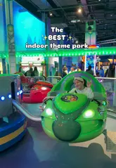 Family enjoying thrilling rides and attractions at Babylon Park, an indoor theme park in Camden, London.