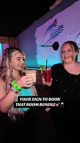Here are a few options for SEO alt text based on your caption:

**Option 1 (Focus on food/drink specifics):**
"Customers enjoying a 'boom bundle' of loaded fries, chicken wings, and cocktails at Boom Battle Bar in Edinburgh." (122 characters)

**Option 2 (Slightly more general food, emphasize value):**
"People sharing a delicious 'boom bundle' meal and drinks deal at Boom Battle Bar, a fun venue in Edinburgh." (119 characters)

**Option 3 (Concise and direct):**
"Boom Battle Bar's 'boom bundle' food and drinks offer enjoyed by guests in Edinburgh, Scotland." (109 characters)

I recommend **Option 1** as it's specific about potential food items, which is great for SEO and accessibility.