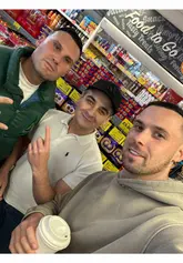 Gymskin and Tommy Tokka posing with a fan at an event in Cardiff.