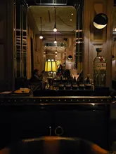 A short, cinematic video showcasing the signature martini trolley service at the Connaught Bar in London. The footage focuses on the bartender preparing the drink with precision, highlighting the luxury setting and the bespoke nature of the cocktail experience.