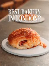 An array of delicious baked goods, including flaky croissants, pastries, muffins, and artisan bread, available at a vibrant bakery.