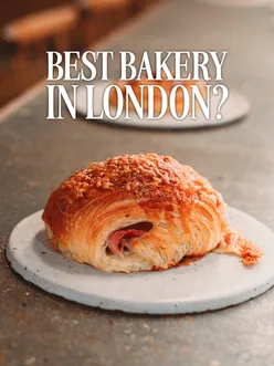 An array of delicious baked goods, including flaky croissants, pastries, muffins, and artisan bread, available at a vibrant bakery.