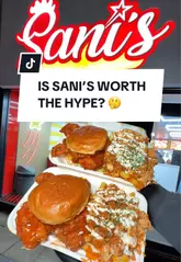 Sani's crispy fried chicken loaded box with fries and sauces, served at Sani's Bradford on Leeds Road.
