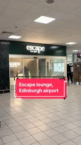 Here are a few options, pick the one that best reflects the *actual content* of your image:

**Option 1 (General lounge scene):**
Travelers relaxing and enjoying amenities in the comfortable Escape Lounge at Edinburgh Airport.

**Option 2 (Focus on comfort/space):**
Spacious interior of the Escape Lounge at Edinburgh Airport, offering comfort and amenities for travelers.

**Option 3 (If people are prominent):**
People relaxing and dining in the modern Escape Lounge at Edinburgh Airport, perfect for airport diaries.