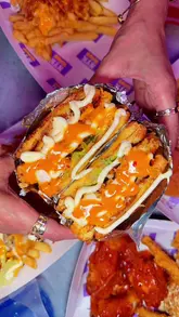 A fast-paced promotional video for NYK in Bradford, showcasing their new menu featuring fried chicken burgers, loaded sandwiches, wings, tenders, and desserts. The video uses close-up shots and quick cuts to highlight the textures and sauces of the food.