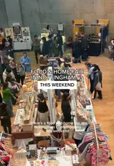 A short, engaging video showcasing a food and home fair at Nottingham Contemporary. The creator walks through the venue, highlighting various artisan stalls selling ceramics, crafts, and food products, while also capturing the atmosphere with a live DJ and pizza service.