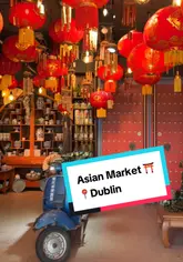 Here are a few options for your SEO alt text, depending on the specific focus of the image:

**Option 1 (Descriptive & SEO-focused):**
"Shelves stocked with authentic Asian groceries and snacks inside the Asian Market in Dublin city center."

**Option 2 (Action-oriented):**
"A shopper browsing the aisles at the Asian Market in Dublin for international food ingredients."

**Option 3 (Short & Punchy):**
"Colorful food products and grocery items on display at the popular Asian Market in Dublin."

**SEO Tip:** Including the location ("Dublin") and the specific store type ("Asian Market") is great for local search discoverability.