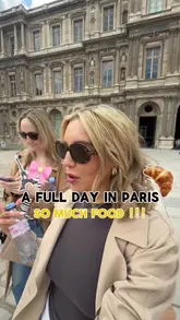 Paris street food tour - croissants, macarons, and baguettes enjoyed by a happy woman.