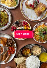Here are a few options for your SEO alt text, depending on the specific focus of the image:

**Option 1 (Focus on food/dishes):**
Delicious brunch and dinner dishes served at Sip n Spice restaurant in Wilmslow, Manchester.

**Option 2 (Focus on the atmosphere/venue):**
Warm and inviting interior of Sip n Spice restaurant in Wilmslow, serving fresh halal food.

**Option 3 (Best for general restaurant photography):**
Tasty food and drinks at Sip n Spice, a halal-friendly restaurant on Water Lane in Wilmslow.

**SEO Tip:** If the image shows a specific dish (e.g., pancakes or a curry), swap "food" for the actual name of the dish to help with image search rankings.