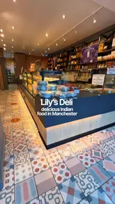 A short, engaging montage showcasing Lily's Deli in Manchester, highlighting their vegetarian Indian street food, curries, samosas, and the shop section selling traditional snacks and ingredients.