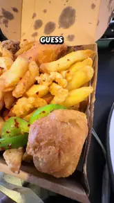A short video review of a 'Megabox' from a Chinese takeaway in Phibsborough, Dublin. The creator presents the box of food, dips a piece of chicken in curry sauce, and asks the viewer to guess the price.