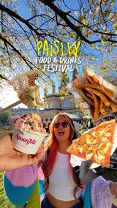 Here are a few options for your SEO alt text, depending on what the photo shows:

**Option 1 (Best if the image shows a variety of the food):**
"An assortment of street food including dumplings, birria tacos, pepperoni pizza, and churros at Paisley Food Festival."

**Option 2 (Focusing on the event):**
"People enjoying diverse street food stalls and sunny spring weather at the Paisley Food & Drink Festival 2026."

**Option 3 (Concise and descriptive):**
"Selection of gourmet street food like dumplings, tacos, and desserts at the outdoor Paisley Food and Drink Festival."

**SEO Tip:** I recommend including the location ("Paisley") and the event name ("Food and Drink Festival") as these are the strongest keywords for local search traffic.