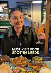 Iconic Bundobust Leeds: A colourful spread of vegetarian Indian street food small plates, perfect for sharing.