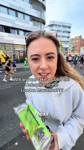 Here are a few options for your SEO alt text, keeping it under 125 characters:

**Option 1 (Descriptive):**
Runner holding a Colin the Caterpillar cake as fuel during the London Marathon race.

**Option 2 (Action-focused):**
Person handing out a Colin the Caterpillar cake to spectators at the London Marathon.

**Option 3 (Concise):**
Colin the Caterpillar cake being used as running fuel during the London Marathon. 

**SEO Tip:** I recommend **Option 1 or 3** as they include the specific brand name ("Colin the Caterpillar") and the location/event ("London Marathon"), which are the two most important keywords for search engines.