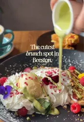 A short, aesthetic montage showcasing brunch dishes, coffee, and the interior of Bistro 66 in Beeston. The video features close-up shots of food preparation and presentation, including pancakes and avocado toast, set to music.