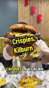 Here are a few options for your alt text (all under 125 characters):

*   **Option 1 (Descriptive):** Close-up of a juicy gourmet burger and crispy chicken wings served at Crispies UK in Kilburn, London.
*   **Option 2 (Action-focused):** A delicious spread of halal burgers and wings on a table at Crispies UK, a popular spot in Kilburn.
*   **Option 3 (SEO-focused):** Freshly prepared halal burger and wings from Crispies UK, a food spot in Kilburn, London.

**SEO Tip:** The best alt text describes what is in the photo while naturally including your primary keywords (e.g., "halal burger," "Crispies UK," "Kilburn").