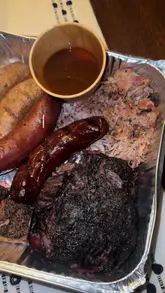 Here are a few options for your SEO alt text, depending on what you want to emphasize:

**Option 1 (Focus on location and product):**
Texas Taff BBQ beef cheek and assorted smoked meats from a local barbecue pop-up in Ystradgynlais, South Wales.

**Option 2 (Descriptive and hungry):**
Close-up of succulent Texas-style BBQ beef cheek and smoked meats served by Texas Taff BBQ in Ystradgynlais.

**Option 3 (Concise and keyword-heavy):**
Smoked Texas-style BBQ beef cheek and meats from Texas Taff BBQ, a local food vendor in Ystradgynlais, South Wales.

**Tip:** I used "Ystradgynlais" (the correct spelling for the area) as it will help local SEO more effectively than the typo in the original caption!
