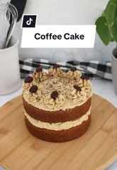 A step-by-step recipe tutorial demonstrating how to bake a coffee cake using Camp Coffee essence, featuring clear, static shots of the mixing and assembly process.