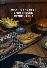 Here are a few options for your SEO alt text, depending on what is actually shown in the image:

**Option 1 (Focus on the food spread):**
A delicious spread of brisket, lamb ribs, wings, and mac & cheese at Salt's Smokehouse in Ealing, London.

**Option 2 (Focus on the brisket/meat):**
Close-up of tender beef brisket and BBQ wings served on a tray at Salt's Smokehouse in West London.

**Option 3 (General/Action-oriented):**
Platter of smoked meat, ribs, and wings at Salt's Smokehouse, a top-rated smokehouse in Ealing.

**SEO Tip:** The best alt text describes exactly what is in the photo while including the location (Ealing) and the business name (Salt's Smokehouse) as those are high-value keywords.