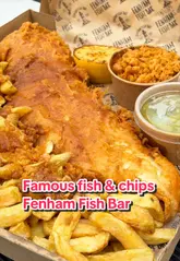 A fast-paced, visually driven showcase of a traditional fish and chip shop in Newcastle, highlighting signature dishes like jumbo cod, fish and chip stotties, and various sides including mushy peas and spicy tartare.