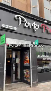 Here are a few options for your SEO alt text, all under 125 characters:

**Option 1 (Descriptive & SEO focused):**
Gourmet piri piri burger with sweetcorn salsa and pickled onions at Porto Piri Piri, Shawlands, Glasgow.

**Option 2 (Action-oriented):**
A delicious gourmet burger with crispy onions at Porto Piri Piri restaurant in Shawlands, Glasgow.

**Option 3 (Concise):**
Tasty piri piri burger with unique toppings at Porto Piri Piri, 49 Kilmarnock Road, Glasgow.

**Tip:** Option 1 is generally the best for SEO as it includes the dish, the restaurant name, and the specific location.