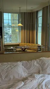 Here are a few options for your SEO alt text (all under 125 characters):

**Option 1 (Descriptive):**
Cozy guest room with a view of King’s Cross Station at the Kaya Great Northern Hotel in London.

**Option 2 (Focus on location/brand):**
Bright and aesthetic hotel room overlooking King’s Cross Station at Kaya Great Northern Hotel, London.

**Option 3 (Keyword-rich):**
Luxury London stay at Kaya Great Northern Hotel near King’s Cross Station and Platform 9 ¾.

**Recommendation:** Use **Option 2** as it best describes the visual content while including your primary keywords for SEO.