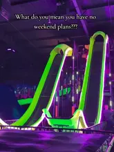 A fast-paced promotional video for an indoor slide park, showcasing various slides, interactive games, and play areas to encourage weekend visits.