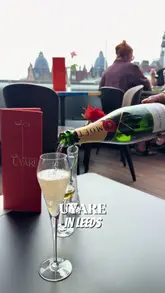 A couple visits Uyare in Leeds for a rooftop bottomless brunch, showcasing the venue's atmosphere, the variety of tapas dishes, and the premium drink options included in the package.