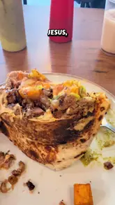 Here are a few options for your SEO alt text (all under 125 characters):

**Option 1 (Descriptive & SEO-focused):**
"A large, loaded Carne Asada burrito with bacon and guacamole served with chips at a Mexican restaurant in Dublin."

**Option 2 (Action-oriented):**
"Delicious loaded Burrito Percheron filled with carne asada, bacon, and guacamole at a top Dublin city centre food spot."

**Option 3 (Concise):**
"Authentic loaded Mexican burrito with carne asada, bacon, and fresh sides at a popular Dublin restaurant."

**Tip:** Option 1 is generally the best for SEO as it describes the specific ingredients and the location clearly.