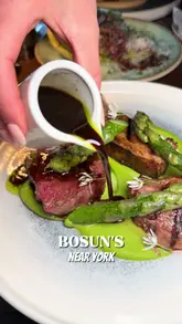 A couple visits Bosun's in York, showcasing the riverside setting, the interior, and a variety of dishes including steak tartare, scallops, lamb, halibut, and desserts. The video serves as a positive review for a date night experience.