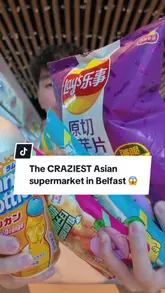 Here are a few options for your SEO alt text, keeping it under 125 characters:

**Option 1 (Descriptive):**
Asian supermarket aisles stocked with snacks and drinks at 43 Botanic Ave in Belfast.

**Option 2 (Action-oriented):**
Customer shopping for unique Asian snacks and bubble tea at a grocery store in Belfast.

**Option 3 (SEO-focused):**
Wide selection of Asian food, snacks, and drinks at a popular supermarket on Botanic Ave, Belfast.

**Recommendation:** Use **Option 1 or 3** as they include the location and the specific keywords people are likely to search for.