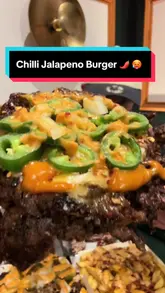 A creator reviews a burger venue, showcasing a chilli jalapeño smash burger, loaded fries, and wings, while comparing the experience to In-N-Out.