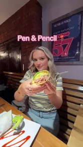 A couple visits 'The Pen & Pencil' in Manchester to review their brunch offerings. The video features shots of the interior, the breakfast burrito, a full English breakfast, halloumi fries, and hot drinks, with the creators sharing their positive experience.