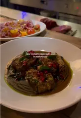 Here are a few options for your SEO alt text, depending on what the photo shows:

**Option 1 (Focus on the food/experience):**
"Gourmet dishes served at the Chef’s Table during a date night at Lennox restaurant in Manchester."

**Option 2 (Focus on the vibe):**
"A romantic date night setting featuring fine dining food at Lennox Manchester restaurant."

**Option 3 (Short & punchy):**
"Fine dining food at the Chef’s Table at Lennox restaurant, a popular date night spot in Manchester."

**SEO Tip:** I included "Lennox Manchester" and "restaurant" in all options, as these are the keywords people are most likely to search for when looking for this venue.