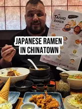 Here are a few options for your alt text, depending on the specific focus of the image:

**Option 1 (Focus on the restaurant):**
A steaming bowl of authentic Japanese ramen served at the newly opened Taisho Ramen restaurant in Manchester.

**Option 2 (Focus on the food/detail):**
Close-up of a delicious, freshly prepared bowl of ramen with toppings at Taisho Ramen in Manchester.

**Option 3 (Short & punchy):**
Bowl of Japanese ramen from the new Taisho Ramen restaurant located in Manchester.

**SEO Tip:** I included "Manchester" and "Ramen" in all of these, as those are the high-value keywords for your post!